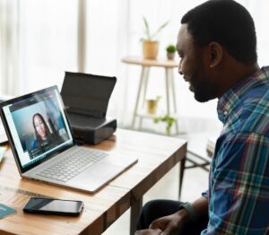 Man video chatting on laptop